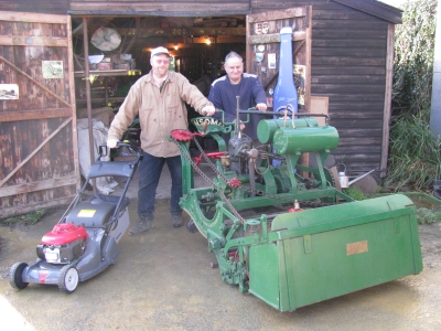 Andrew Hall and Michael Duck with the 1902 Ransomes motor mower and the prize Honda rotary.