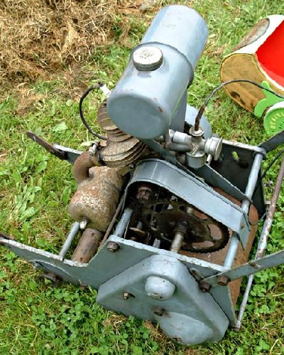 The petrol tank on the Excelsior motor mower was mounted almost directly above the engine.