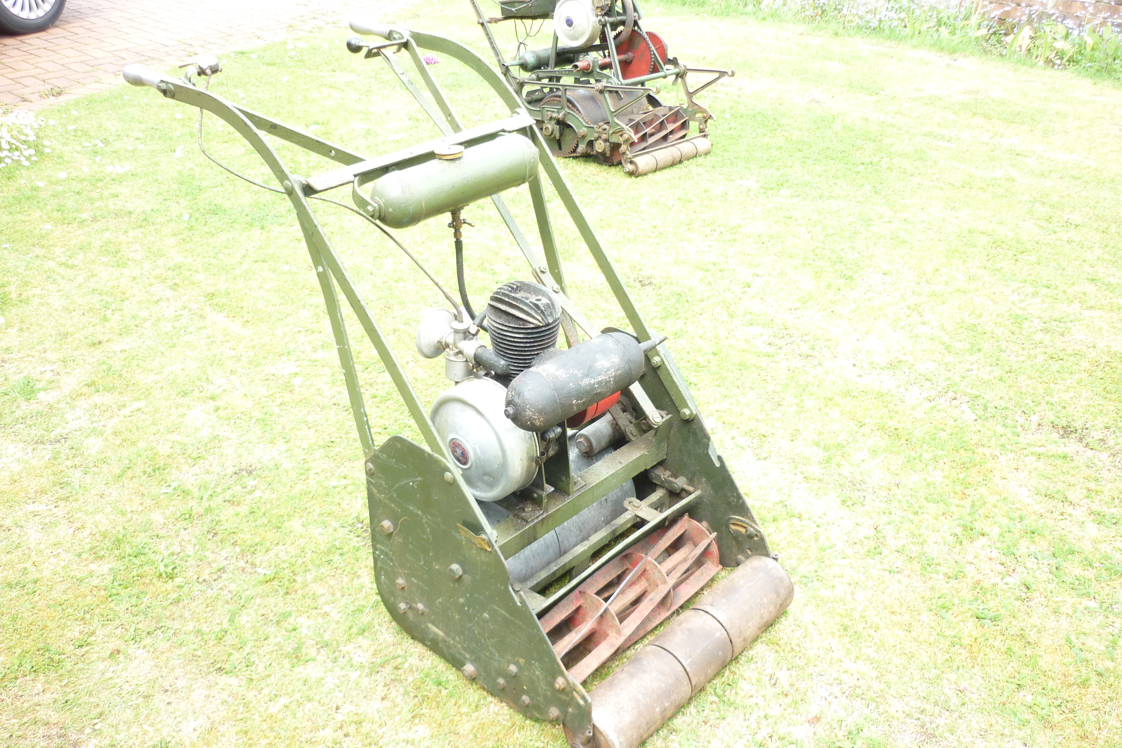 Purchased six years ago from a vintage rally. Simpathicaslly restored by me. I also put a smaller version of the correct petrol tank on the machine. This the mower that you will see me using in a photograph on the clubs website. It is missing its grassbox.